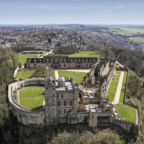 Aerial view of Bolsover Castle including the walls and inner grassy courtyards